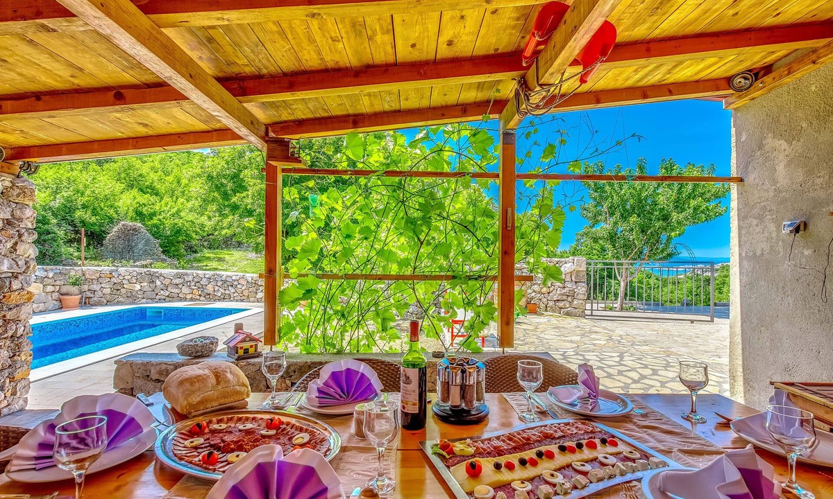 Novi Vinodolski House | House with an ocean view in its own valley, featuring a garden