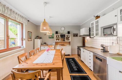 Cezsoca House | Charming house in Čezsoča near Bovec with mountain views. Sleeps up to 7 guests in 3 bedrooms and sofa bed. First-floor apartment close to the Soča River, shops, hiking trails, cycling routes and outdoor adventures.