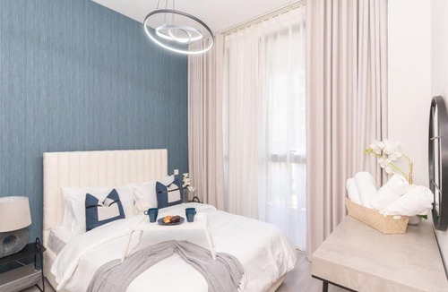Dubai Production City Apartment | Classy 1BR Midtown Stay Near Miracle Garden by Vibel
