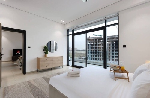 Dubai Production City Apartment | Livbnb-Stylish and Spacious 1B w/Private Balcony