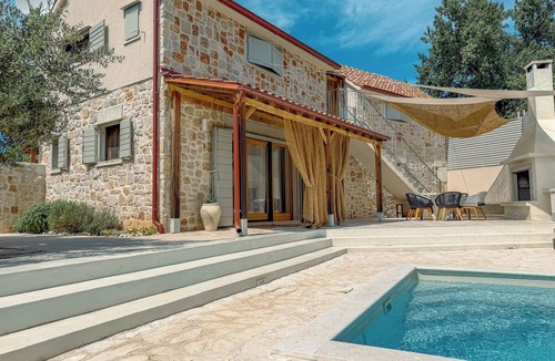 Dol Villa | Modern expression of a traditional Hvar stone house amidst sunny nature.