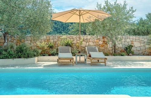 Dol Villa | Modern expression of a traditional Hvar stone house amidst sunny nature.