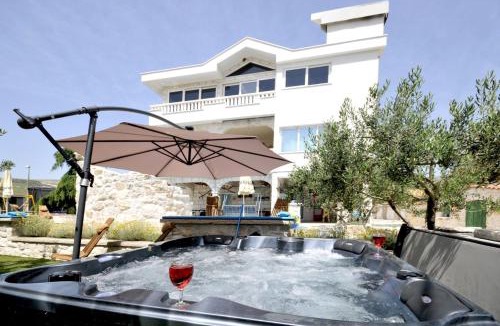 Plano Villa | STAGNUM BABA - Impressive Luxury Villa with heated pool, hot tub, playroom and upscale house design