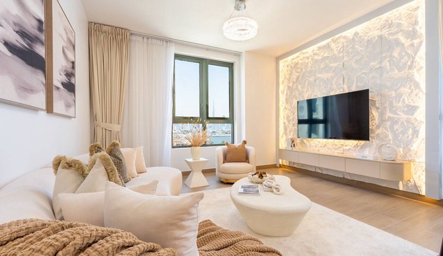 Balcony Facing the Sea with Burj Khalifa Glimpses from the Living to Bedrooms in Dubai