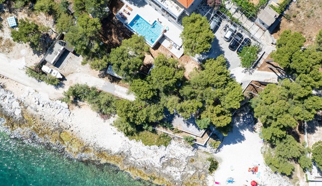Beachfront One-Bedroom Apartment with Sea View & Pool