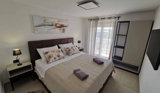 Holiday apartment modernly furnished with shared garden and barbecue