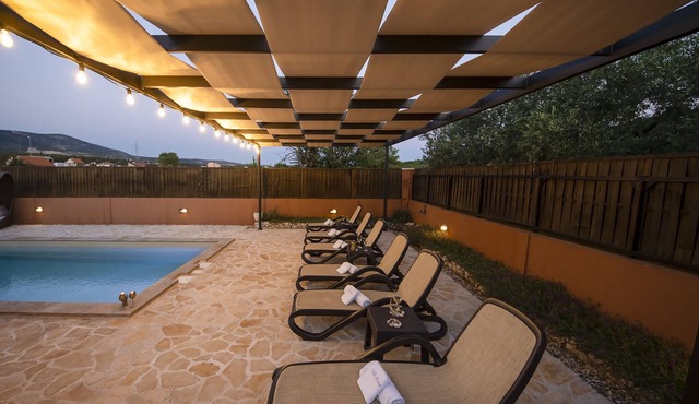 Holiday house with pool on large plot in a green landscape in Šibenik