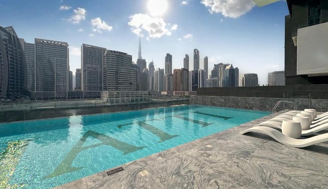 Skyline Views Chic 1BR with Canal Vibes in Dubai