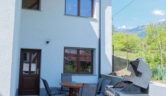 Spacious 2-bedroom apartment with large private terrace and BBQ in Tolmin