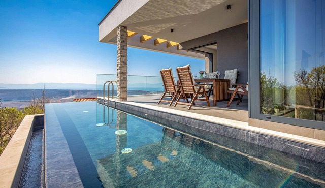 The attractive semi-detached house, which consists of two floors, is located on a hill far from the in Smrika