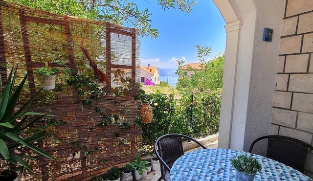 Two bedroom apartment with terrace and sea view Postira, Brač (A-17697-a) in Postira