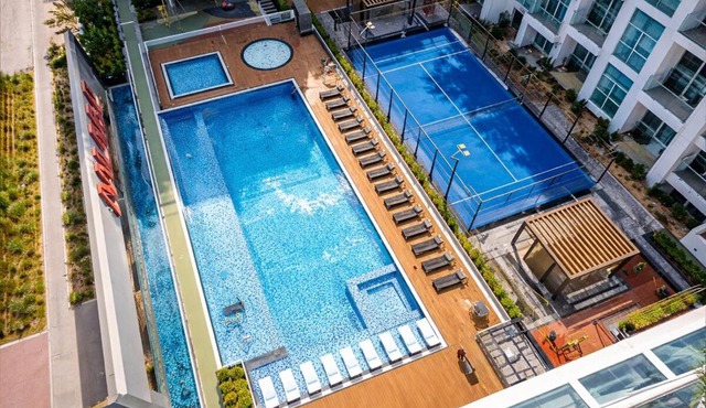 Vogue Vacation Homes, Al Furjan Pearlz by Danube near Ibn Battuta Mall, One Bedroom Apartment with Balcony and vibrant community view, Access to all Amenities, Walkable to Al Furjan Metro Station in Dubai