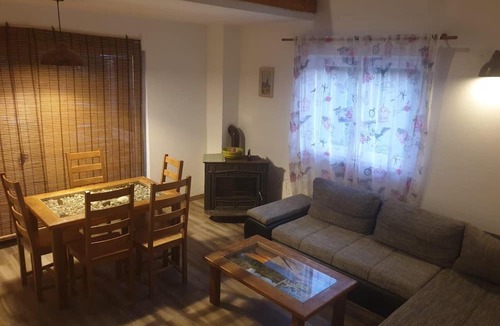 Nin House | House by a river with beds on the gallery